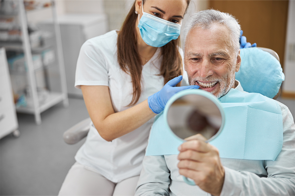 Happy dental patient after getting implants